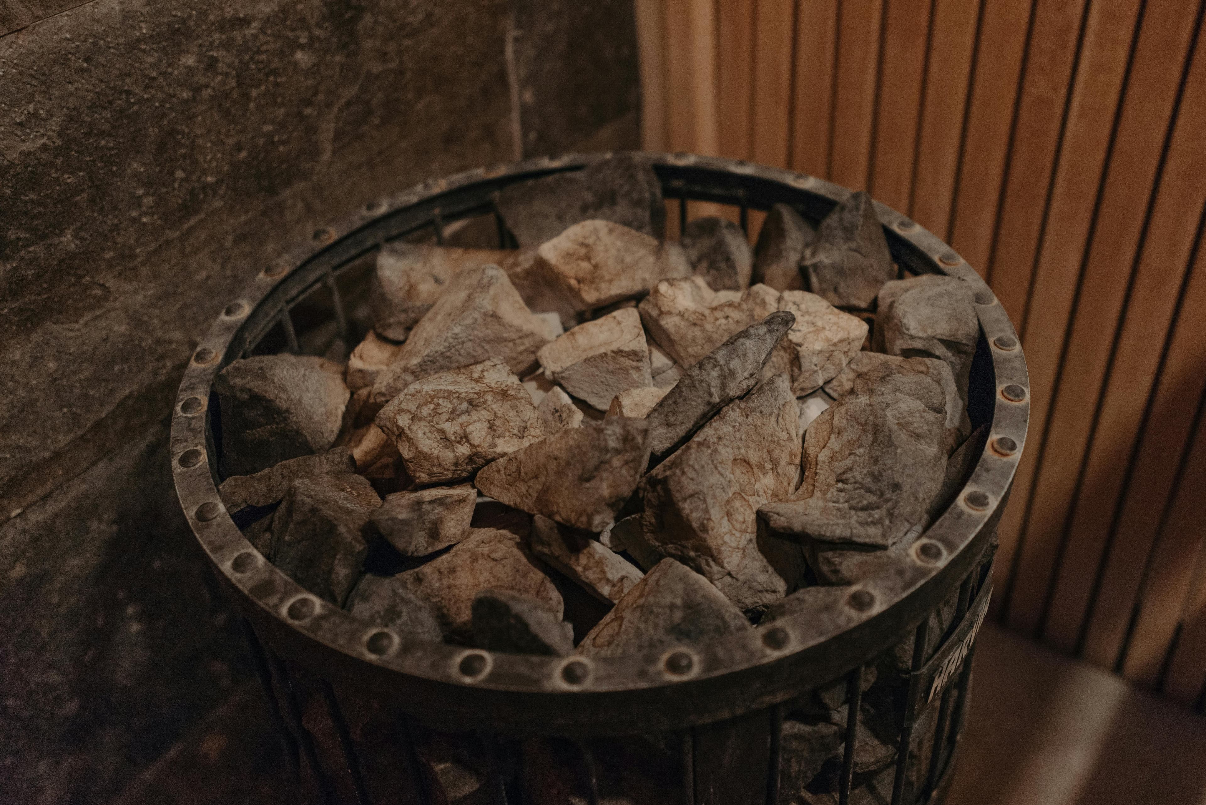 Close-up of hot rocks in a sauna heater